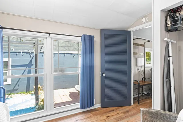 a view of bedroom with wooden floor