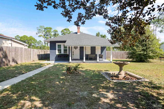a house with trees in the background