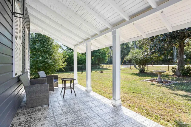 a view of a patio with a backyard