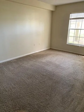 an empty room with a windows