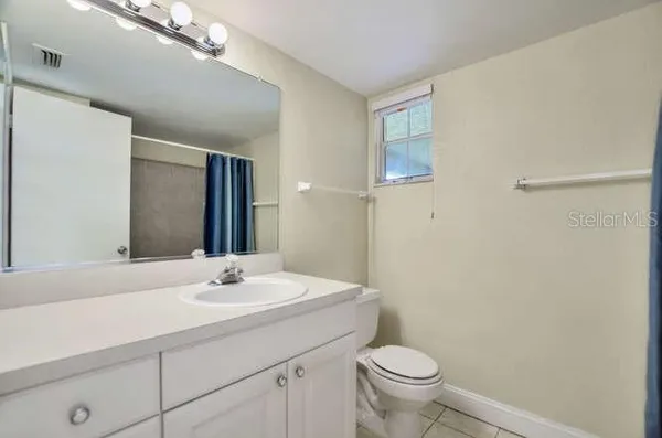 an empty room with closet area