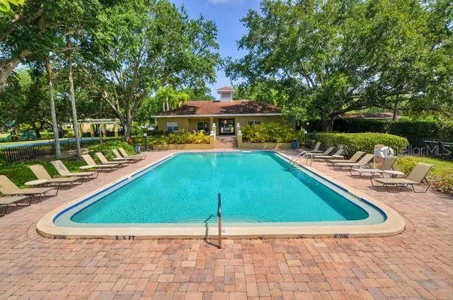 a view of a swimming pool with a patio