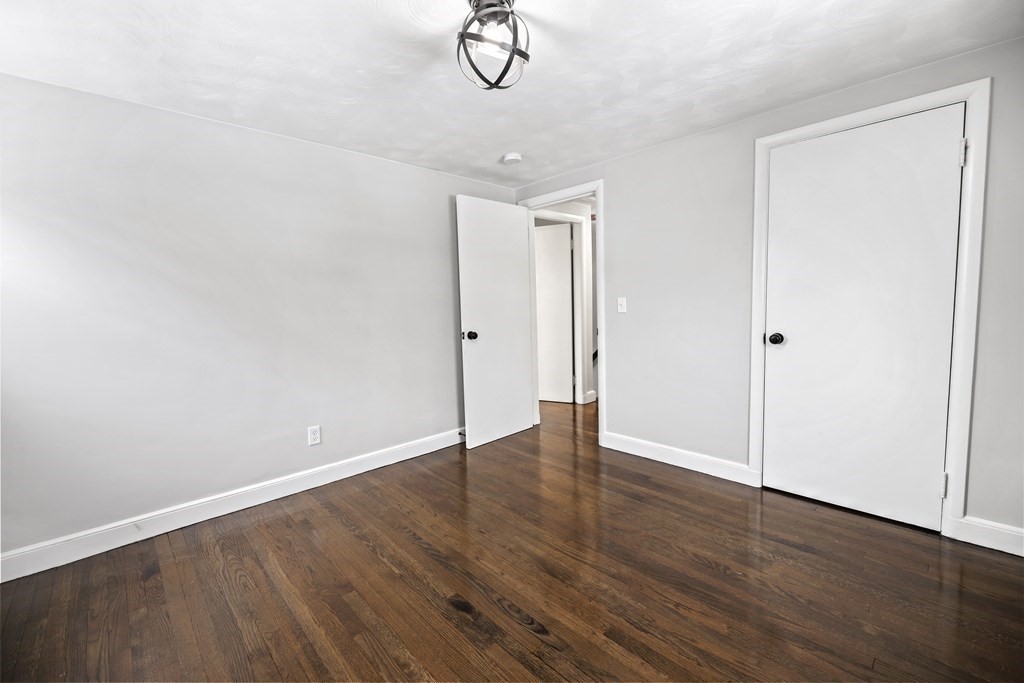40 Como Road Boston, MA 02136 - Photo 18 of 31 a view of a room with wooden floor and white walls