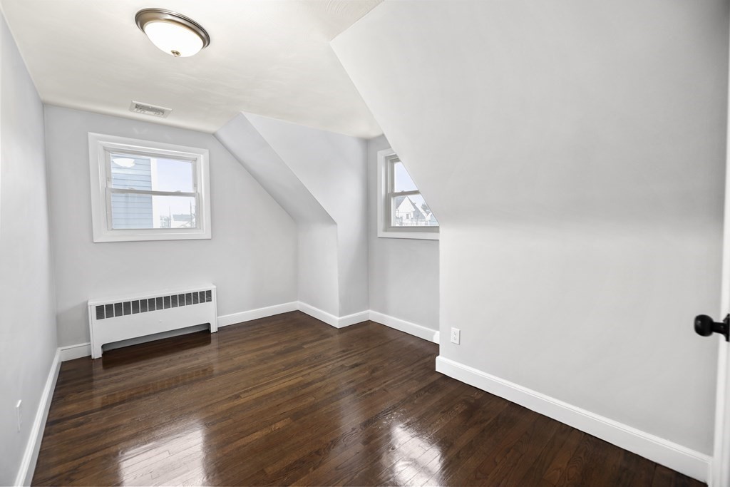 40 Como Road Boston, MA 02136 - Photo 20 of 31 an empty room with wooden floor and windows