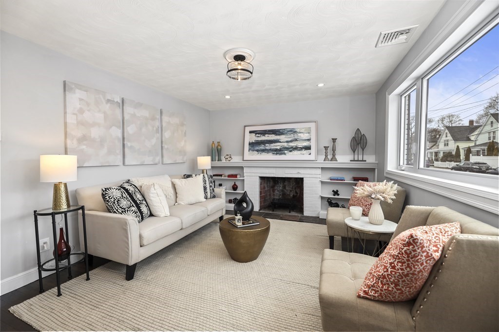 40 Como Road Boston, MA 02136 - Photo 3 of 31 a living room with furniture and a fireplace