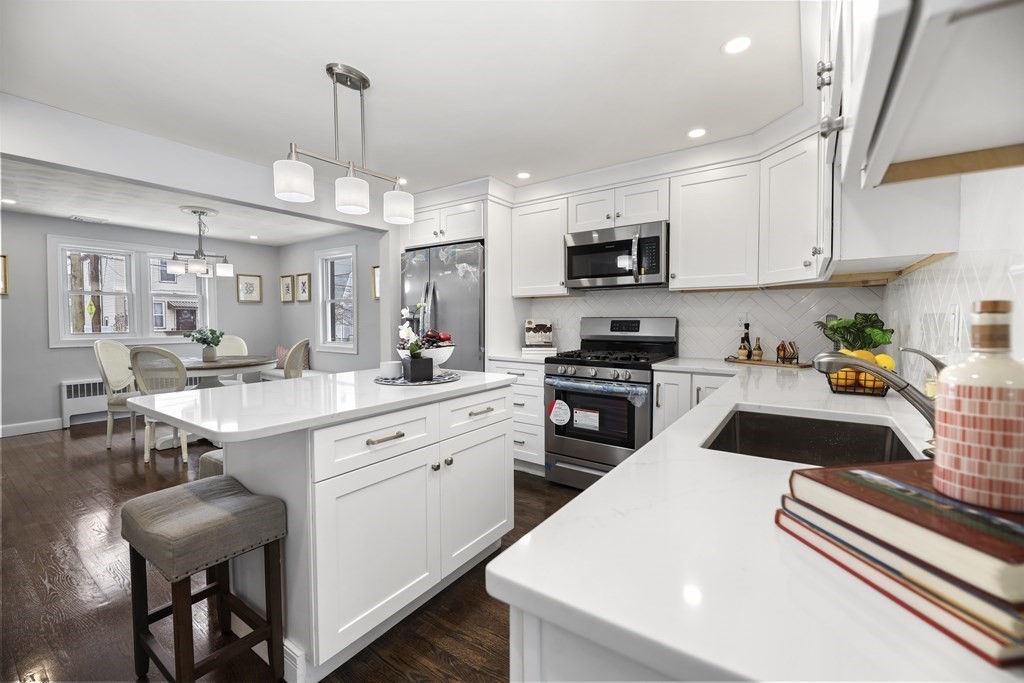 40 Como Road Boston, MA 02136 - Photo 8 of 31 a kitchen with stainless steel appliances kitchen island granite countertop a sink and cabinets