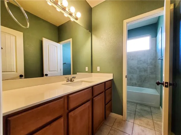 a bath tub sitting next to a toilet