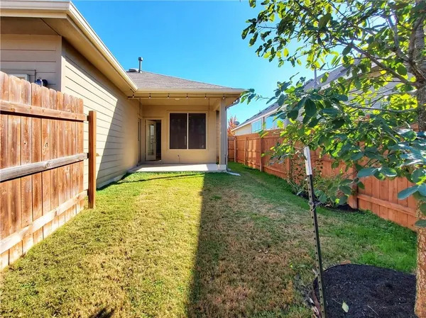 a view of a backyard with plants