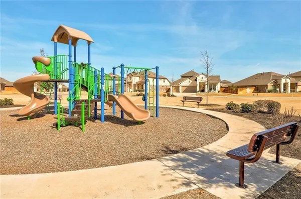 a view of a swimming pool with a lounge chair