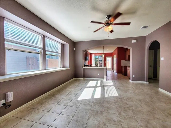 a kitchen with stainless steel appliances granite countertop a stove a sink a microwave and a refrigerator