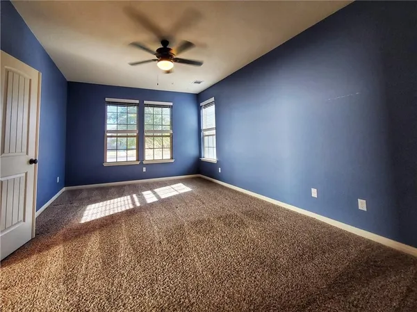 a bathroom with a shower sink and mirror