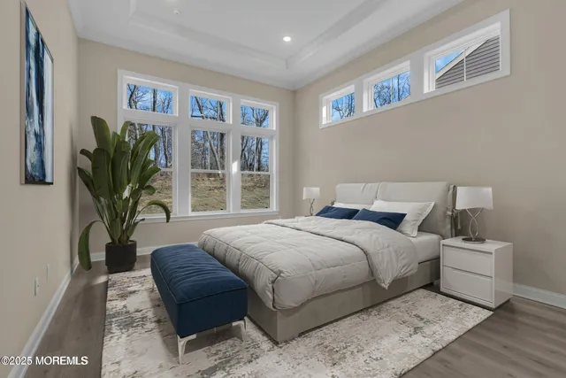 a bedroom with bed and a potted plant