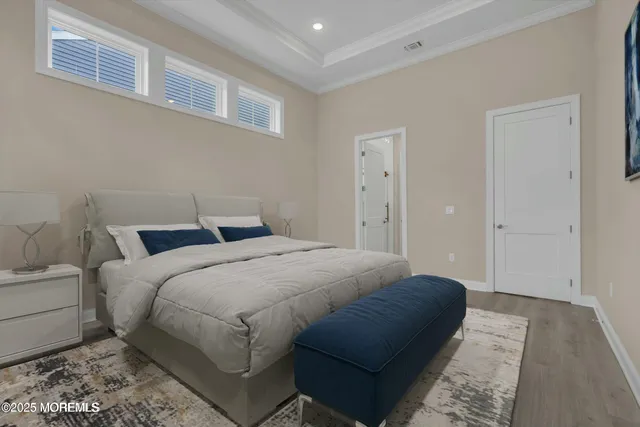 a bedroom with a bed and a couch