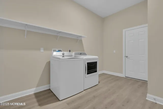 a utility room with washer and dryer