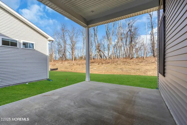 a view of a house with a yard and garage