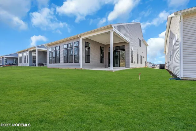 a view of a house with a backyard