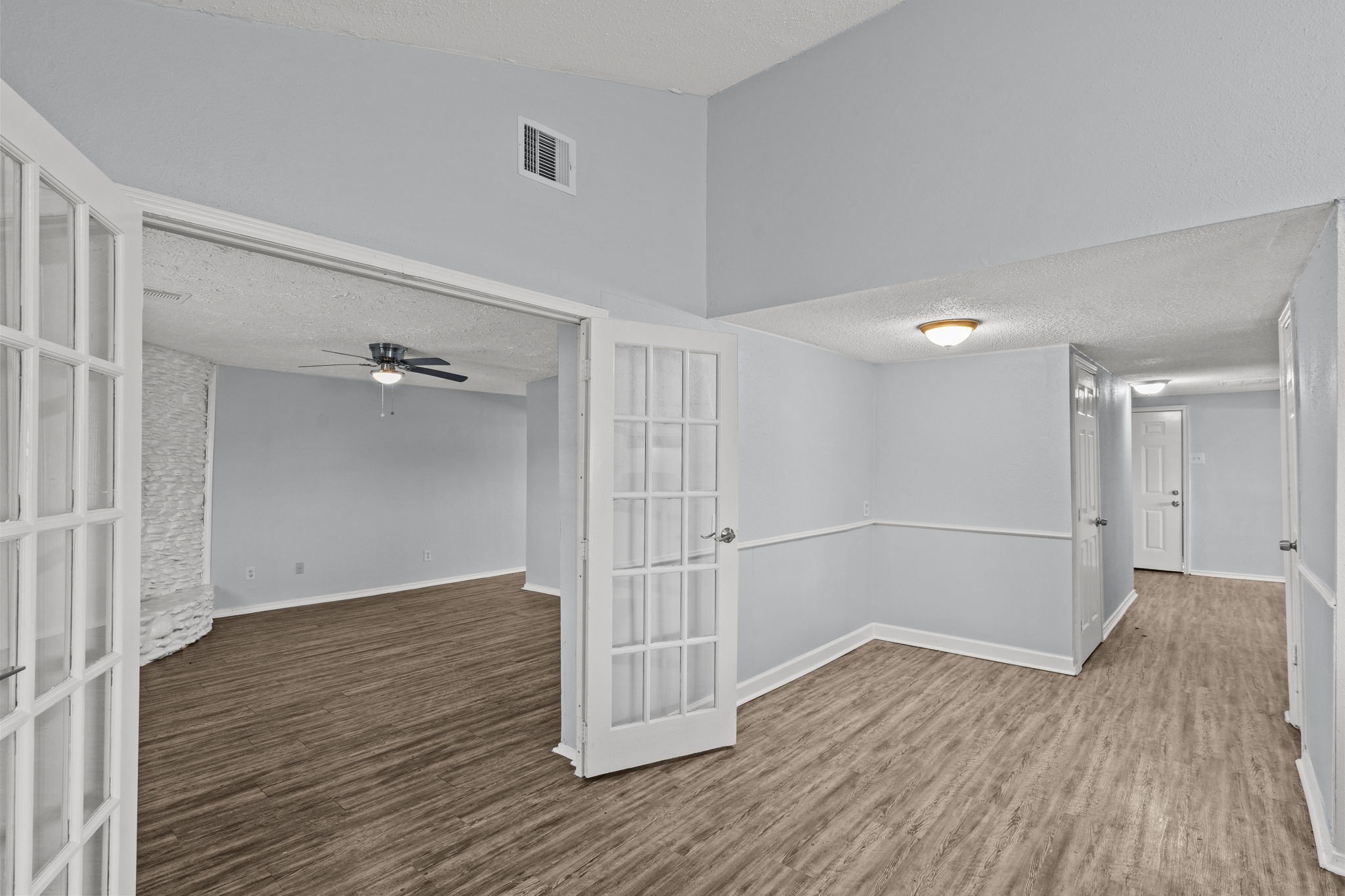 228 Orange Street La Marque, TX 77568 - Photo 15 of 21 an empty room with wooden floor