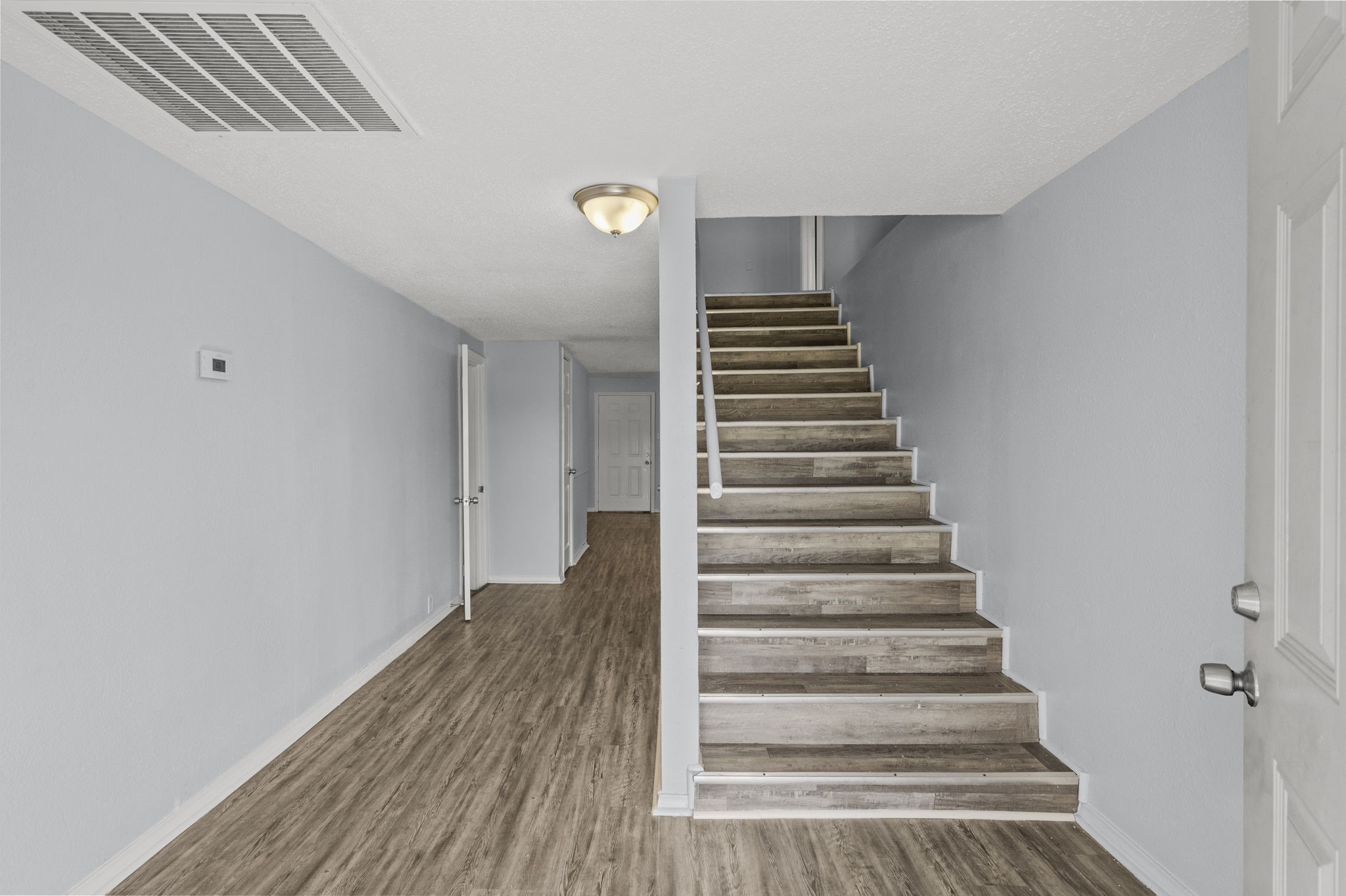 228 Orange Street La Marque, TX 77568 - Photo 4 of 21 a view of entryway with wooden floor