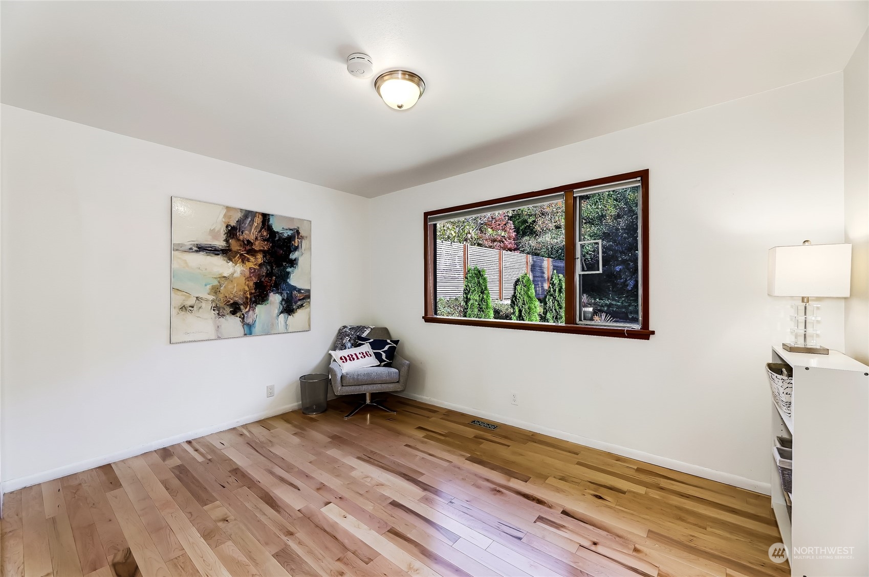 8724 Fauntlee Crest Southwest Seattle, WA 98136 - Photo 18 of 33 a bedroom with a bed and a painting on the wall