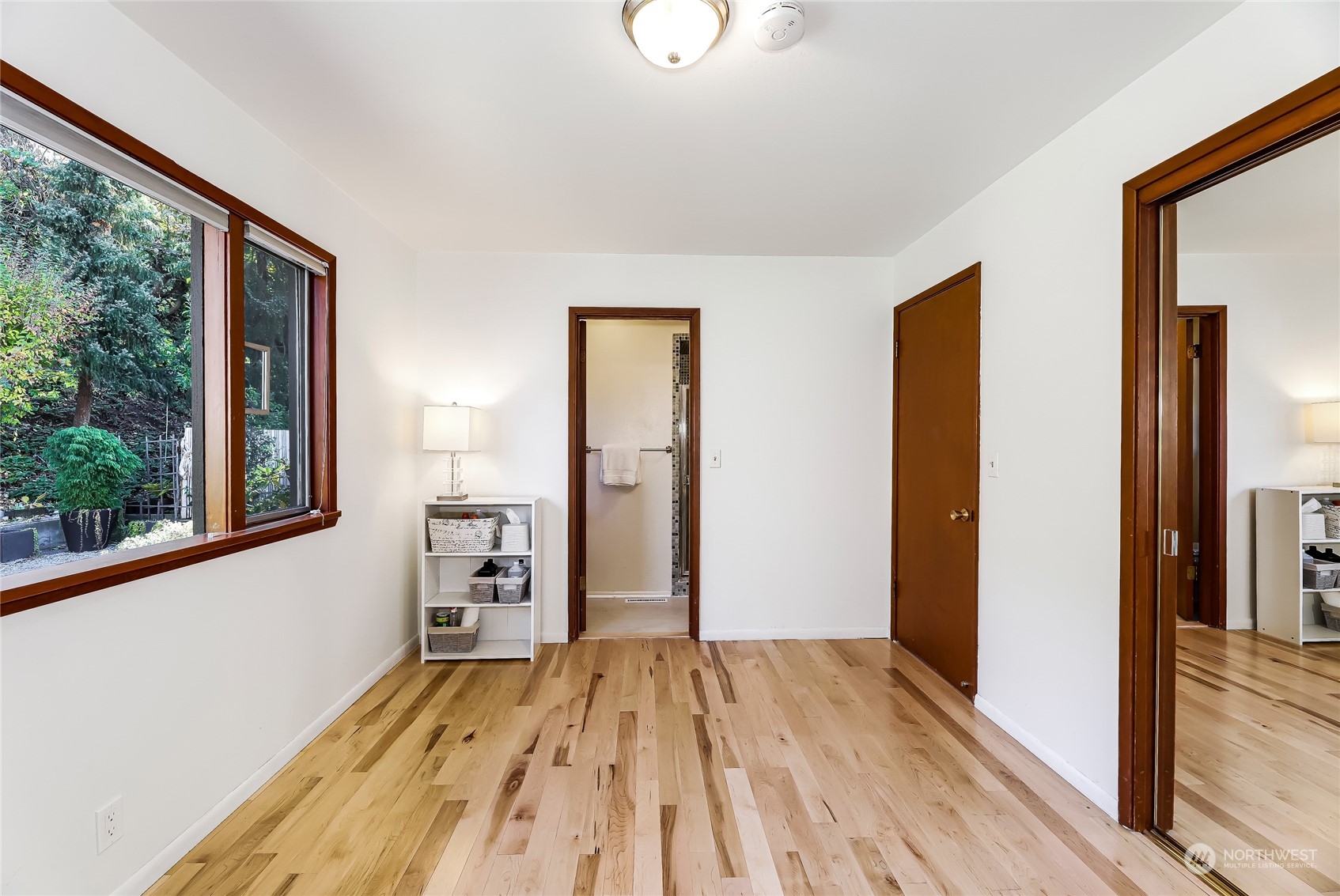 8724 Fauntlee Crest Southwest Seattle, WA 98136 - Photo 19 of 33 a view of empty room with wooden floor and fan