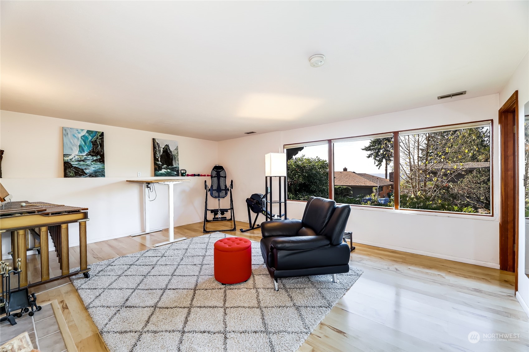 8724 Fauntlee Crest Southwest Seattle, WA 98136 - Photo 21 of 33 a living room with furniture a rug and a large window