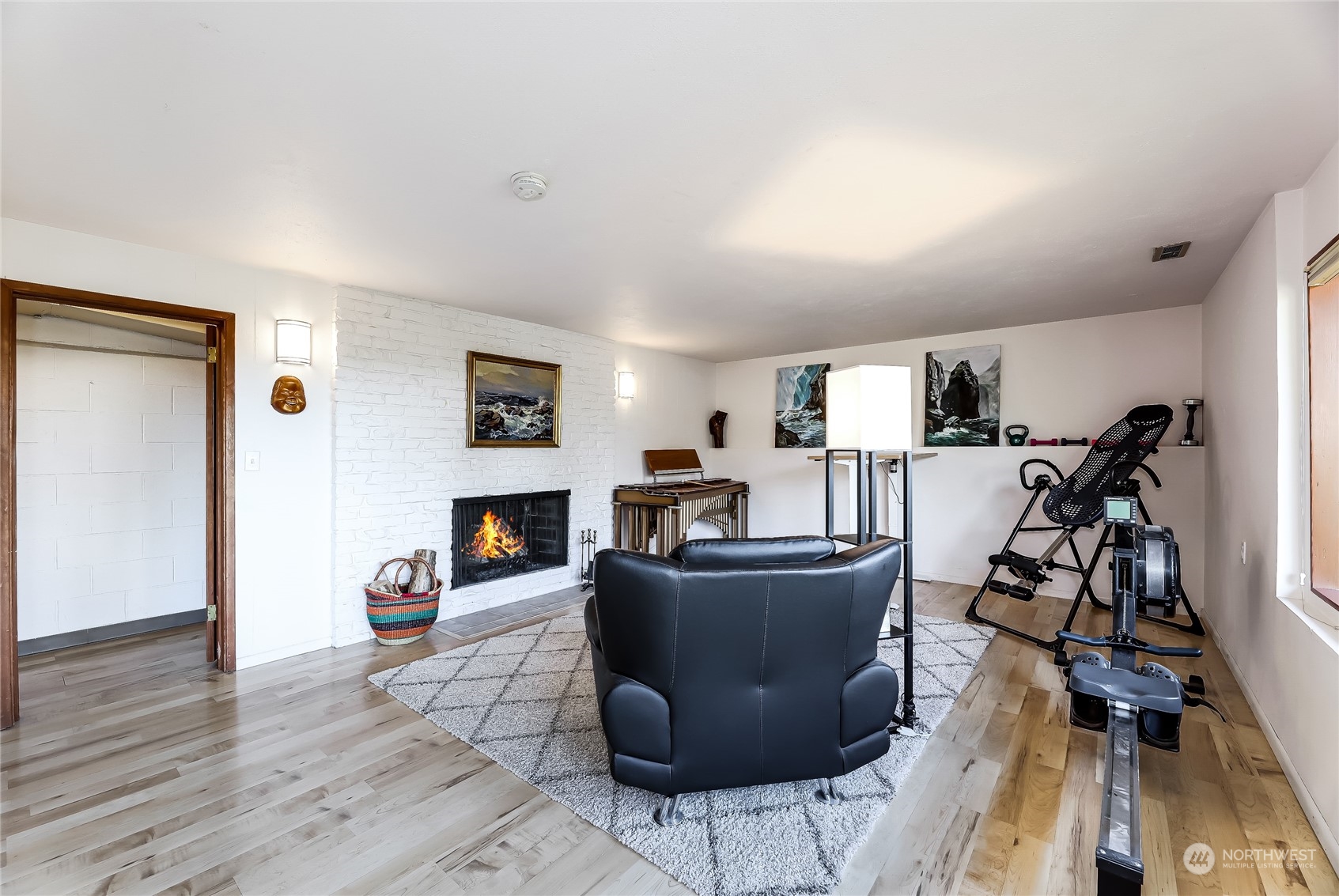 8724 Fauntlee Crest Southwest Seattle, WA 98136 - Photo 22 of 33 a living room with furniture and a fireplace
