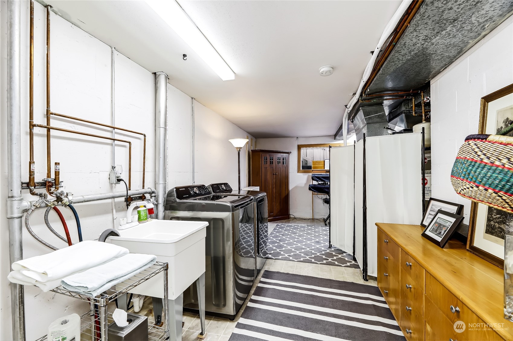 8724 Fauntlee Crest Southwest Seattle, WA 98136 - Photo 23 of 33 a kitchen with stainless steel appliances granite countertop a stove and a refrigerator