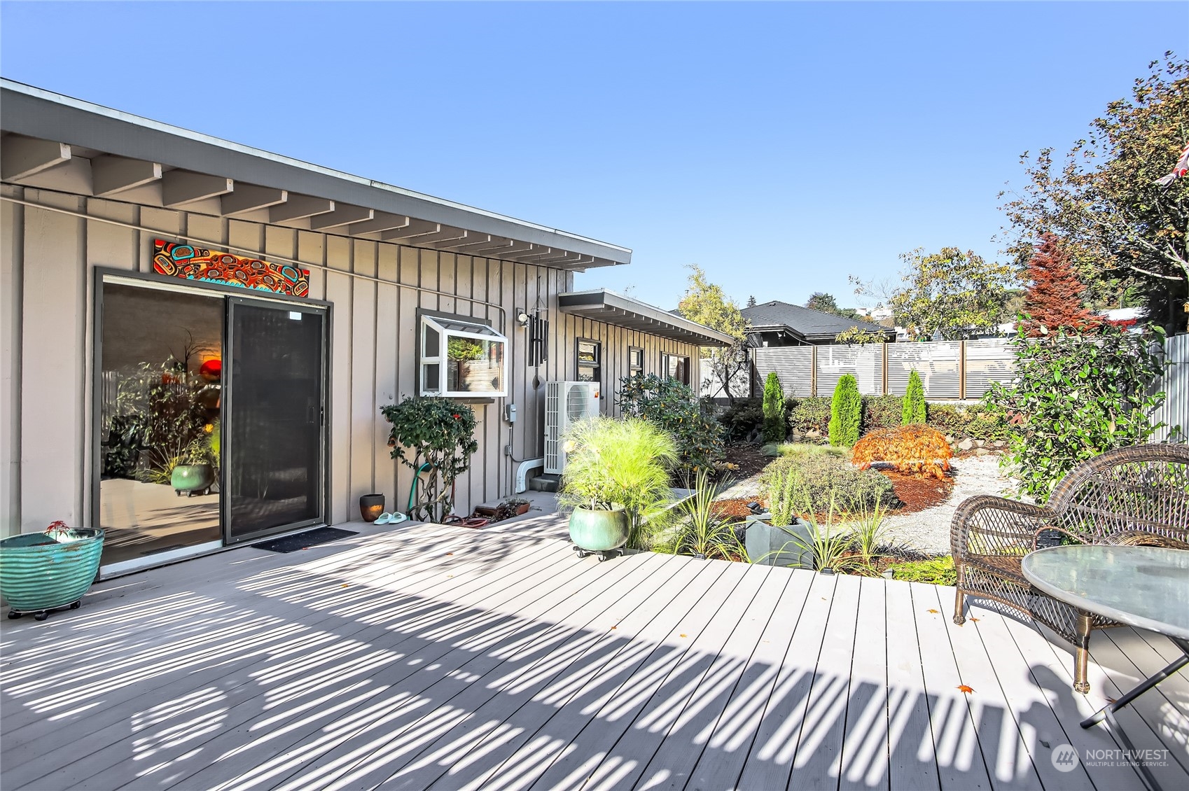 8724 Fauntlee Crest Southwest Seattle, WA 98136 - Photo 26 of 33 a view of a house with a patio