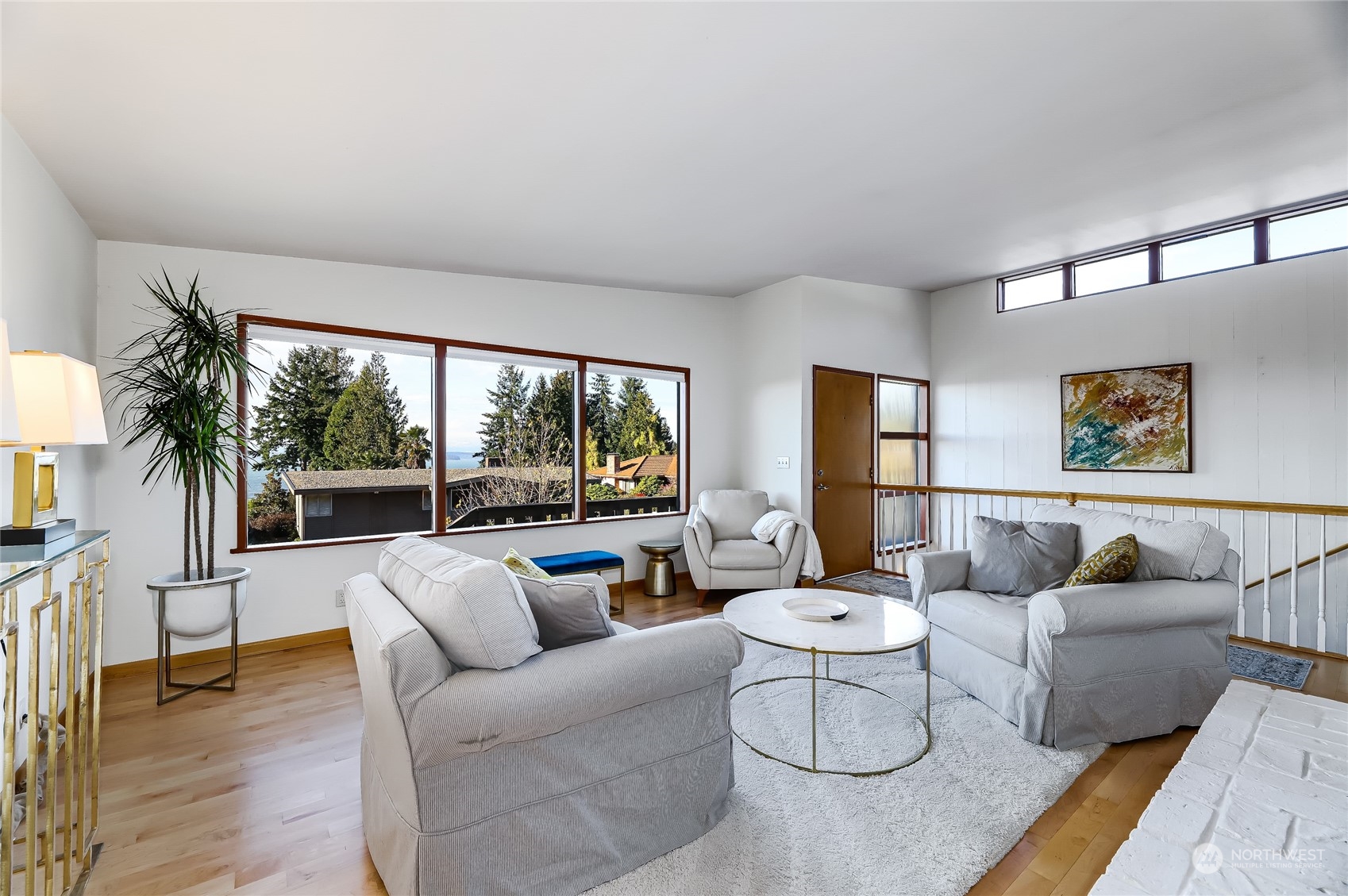 8724 Fauntlee Crest Southwest Seattle, WA 98136 - Photo 6 of 33 a living room with furniture and a large window