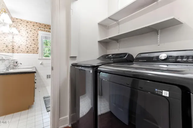 a close view of laundry room with washer and dryer