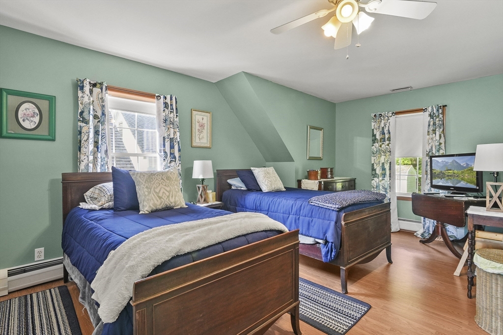 3 Newton Street Barre, MA 01005 - Photo 13 of 39 a bed room with a bed and a chandelier