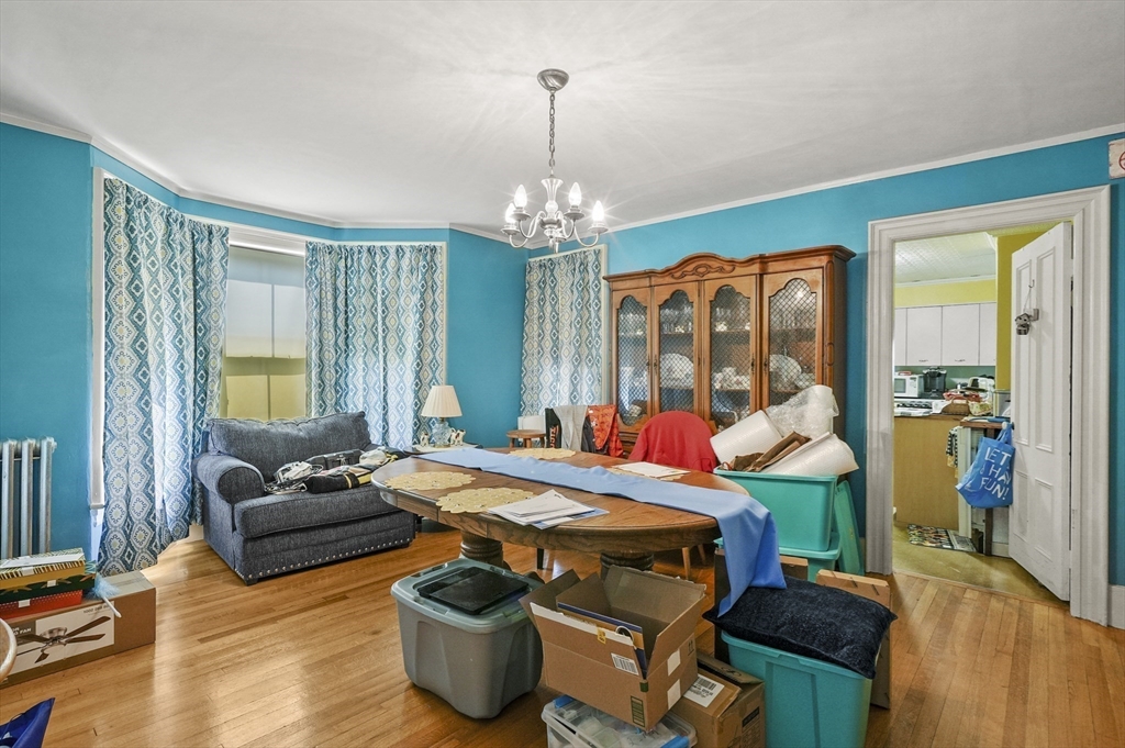 3 Newton Street Barre, MA 01005 - Photo 19 of 39 a bedroom with furniture and a chandelier