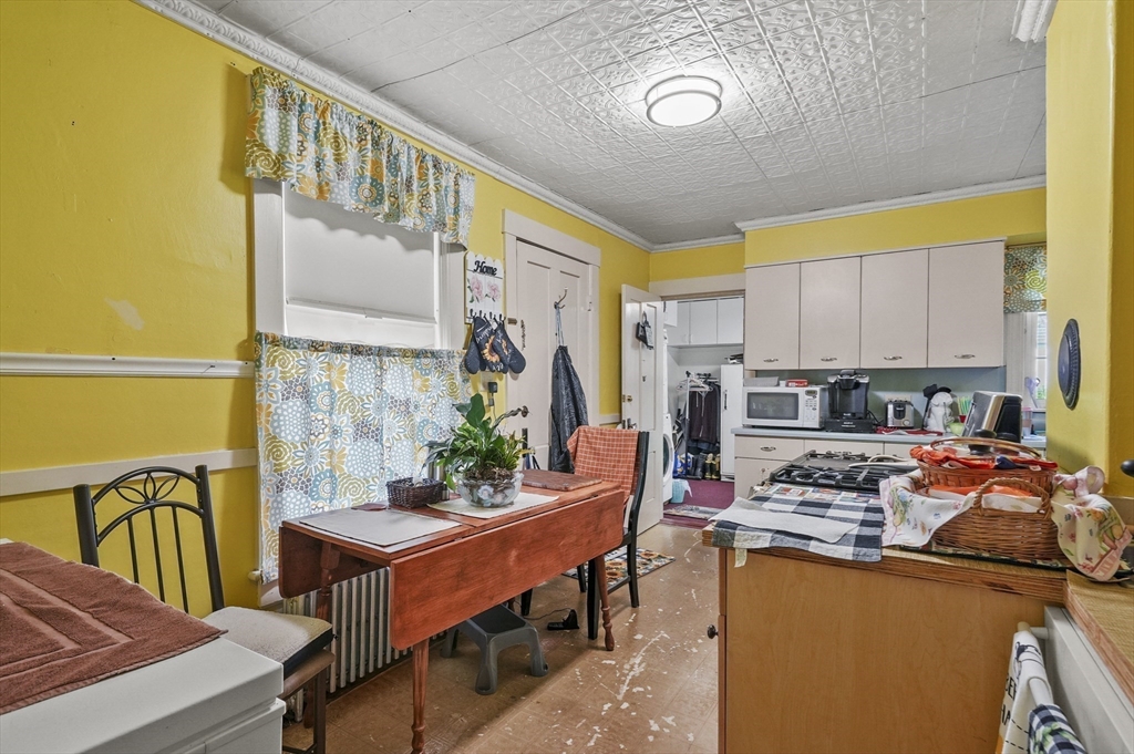 3 Newton Street Barre, MA 01005 - Photo 21 of 39 a living room with stainless steel appliances a dining table and chairs