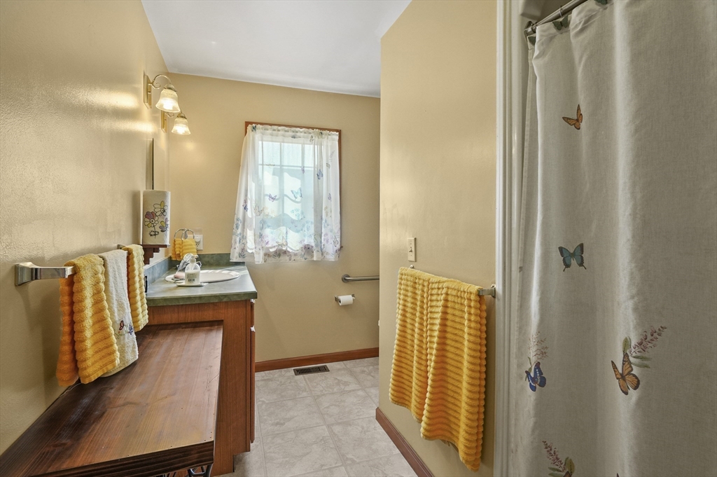 3 Newton Street Barre, MA 01005 - Photo 7 of 39 a bathroom with a tub a mirror and a sink