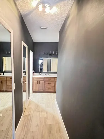 a view of a kitchen from the hallway