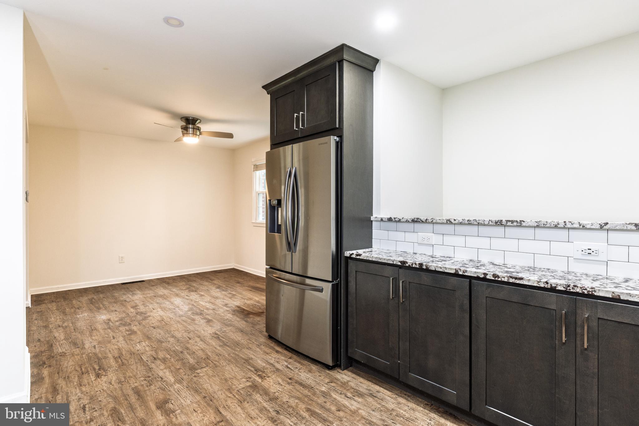 37 Millbrook Road Newark, DE 19713 - Photo 13 of 49 a kitchen with granite countertop a refrigerator and a sink