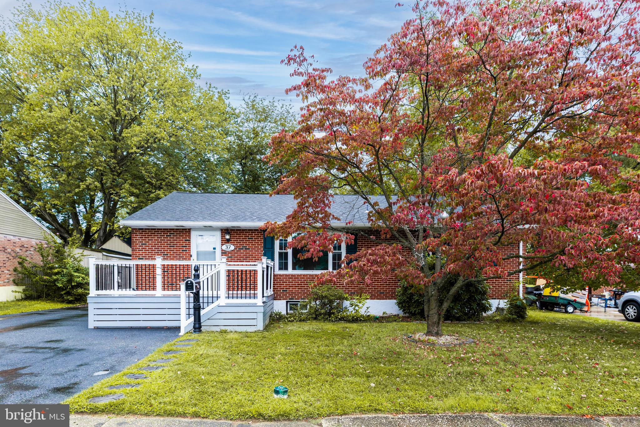37 Millbrook Road Newark, DE 19713 - Photo 2 of 49 a front view of a house with a garden and tree
