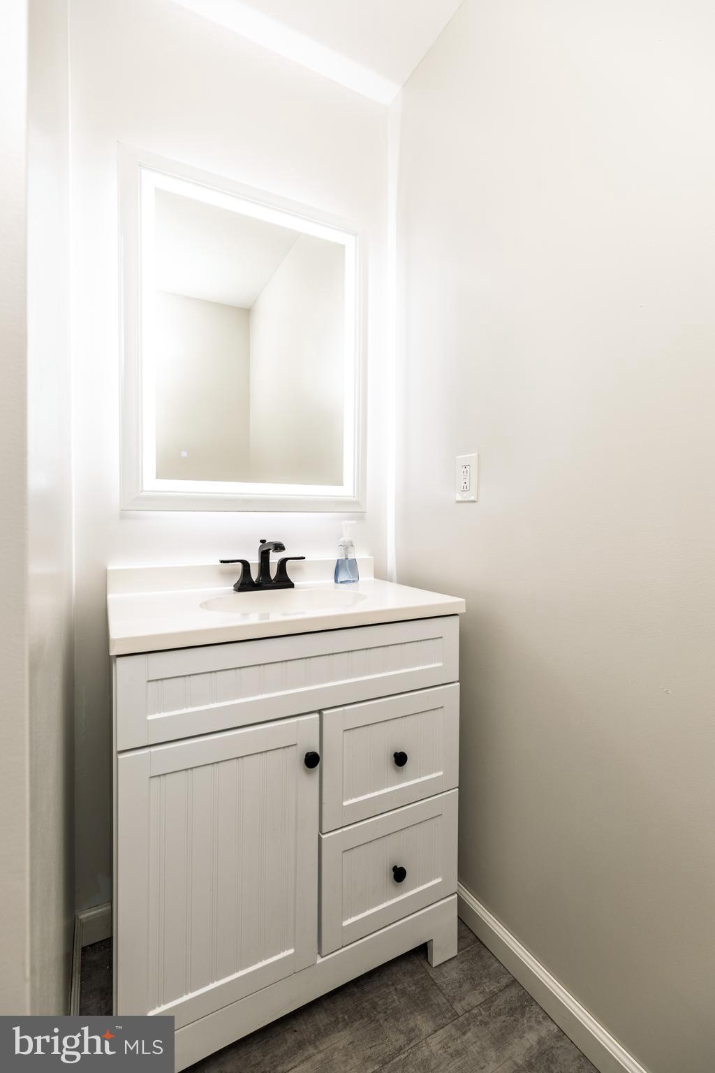 37 Millbrook Road Newark, DE 19713 - Photo 23 of 49 a bathroom with a sink and a mirror