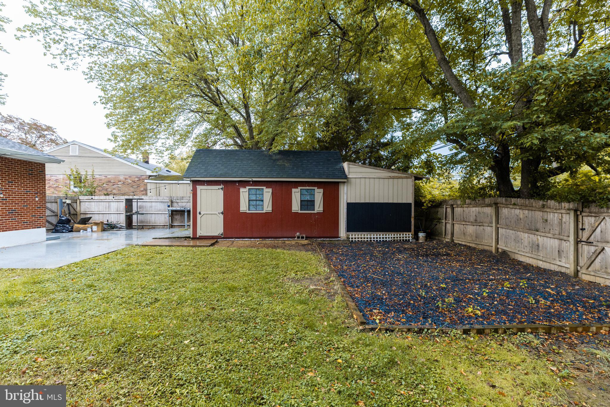 37 Millbrook Road Newark, DE 19713 - Photo 48 of 49 a view of a yard in front of a house with large trees