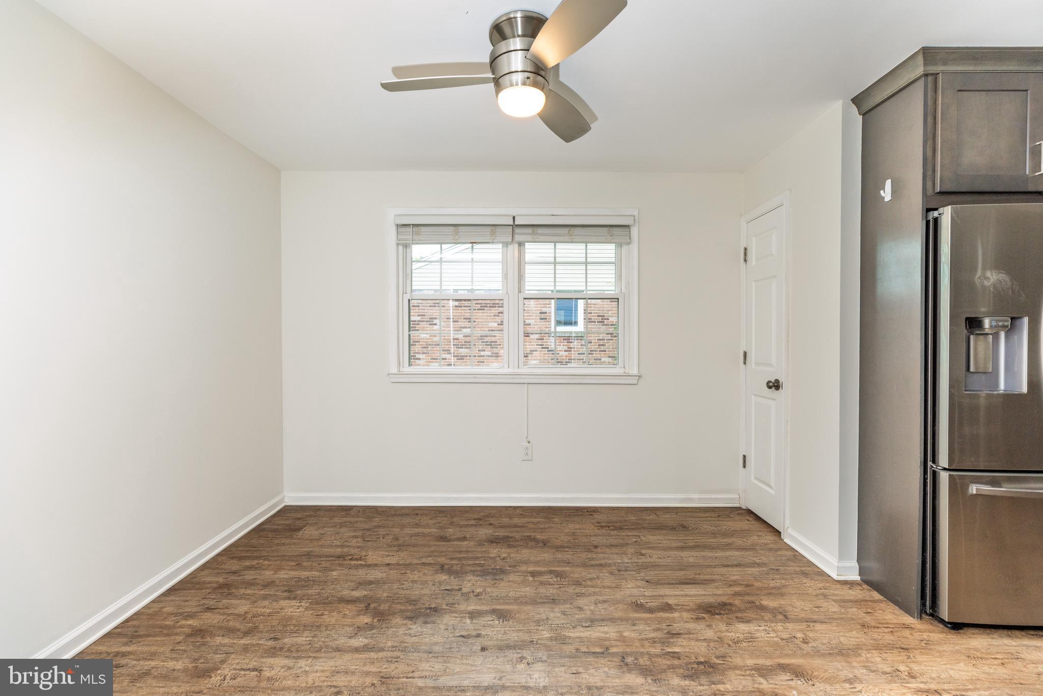 37 Millbrook Road Newark, DE 19713 - Photo 7 of 49 wooden floor in an empty room with a window