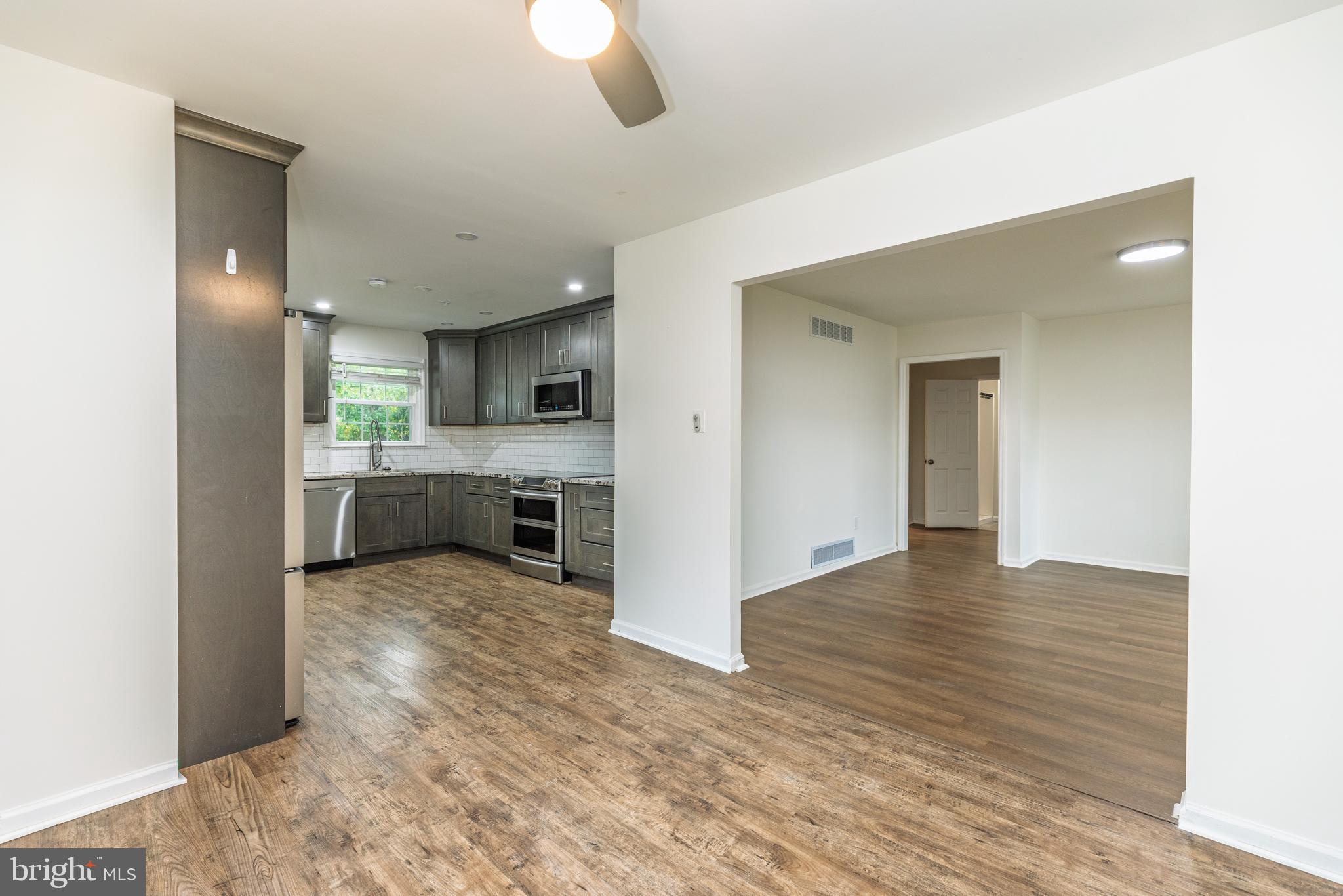 37 Millbrook Road Newark, DE 19713 - Photo 9 of 49 a view of a kitchen with a sink cabinets and a fireplace