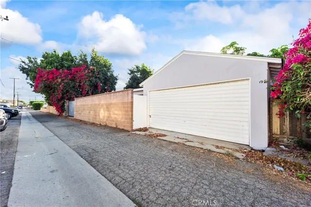 a view of a house with a yard and a garage