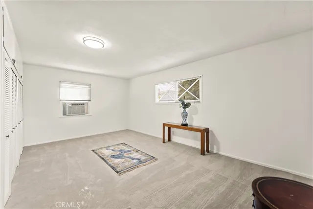 a bedroom with a bed and a table in it