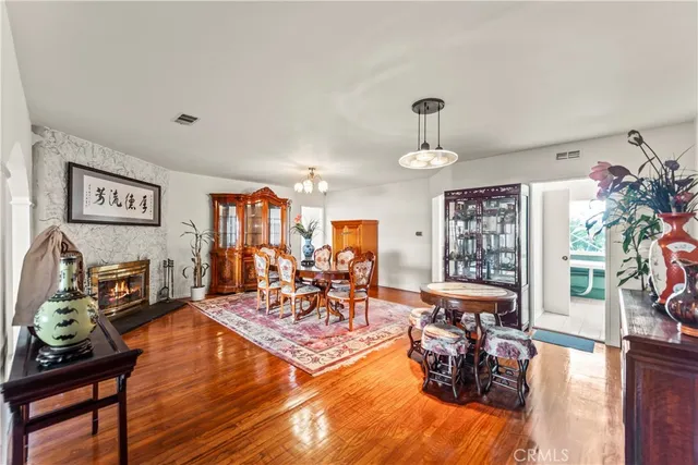a view of a dining room with furniture and chandelier