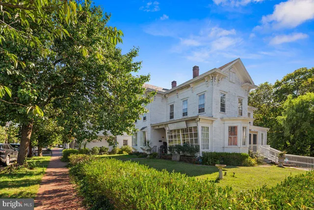 a view of house with yard