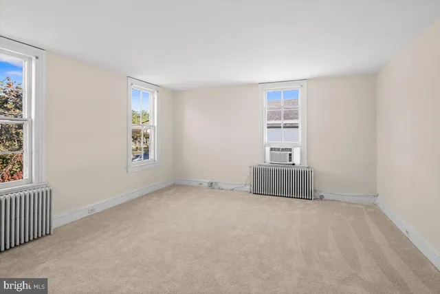 an empty room with windows