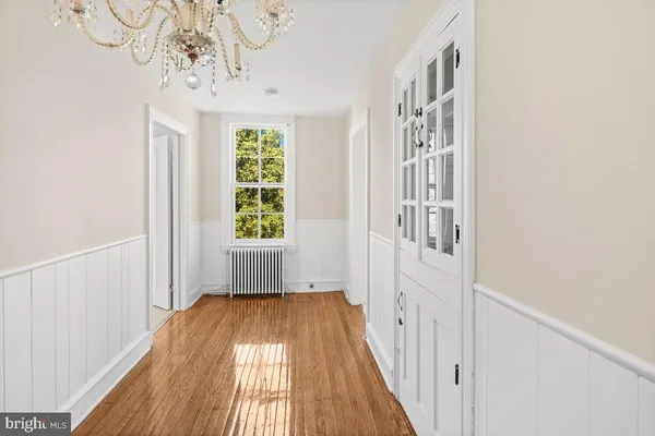 a view of entryway with wooden floor