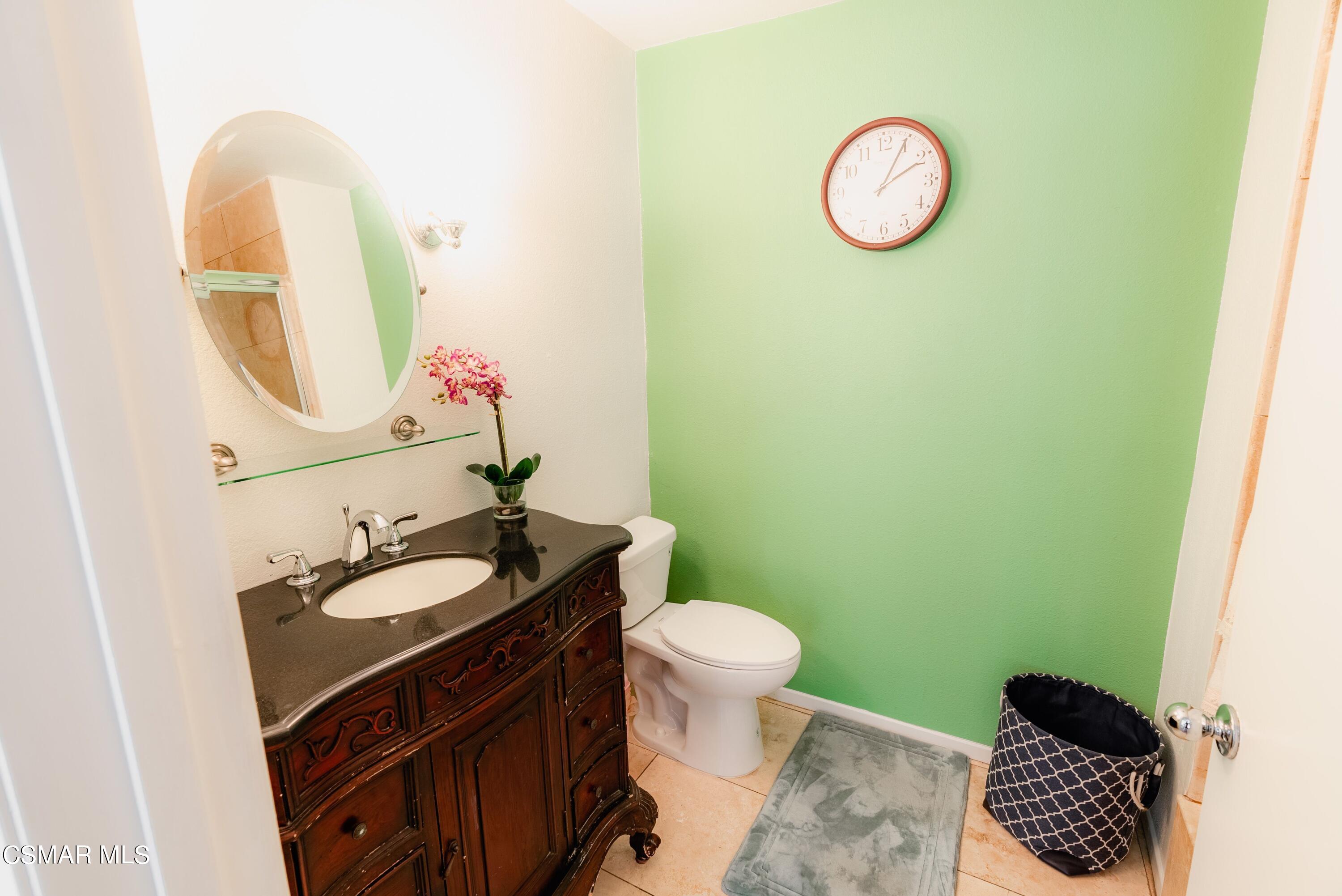 20253 Keswick Street, Unit 233 Winnetka, CA 91306 - Photo 9 of 18 a bathroom with a sink and a mirror