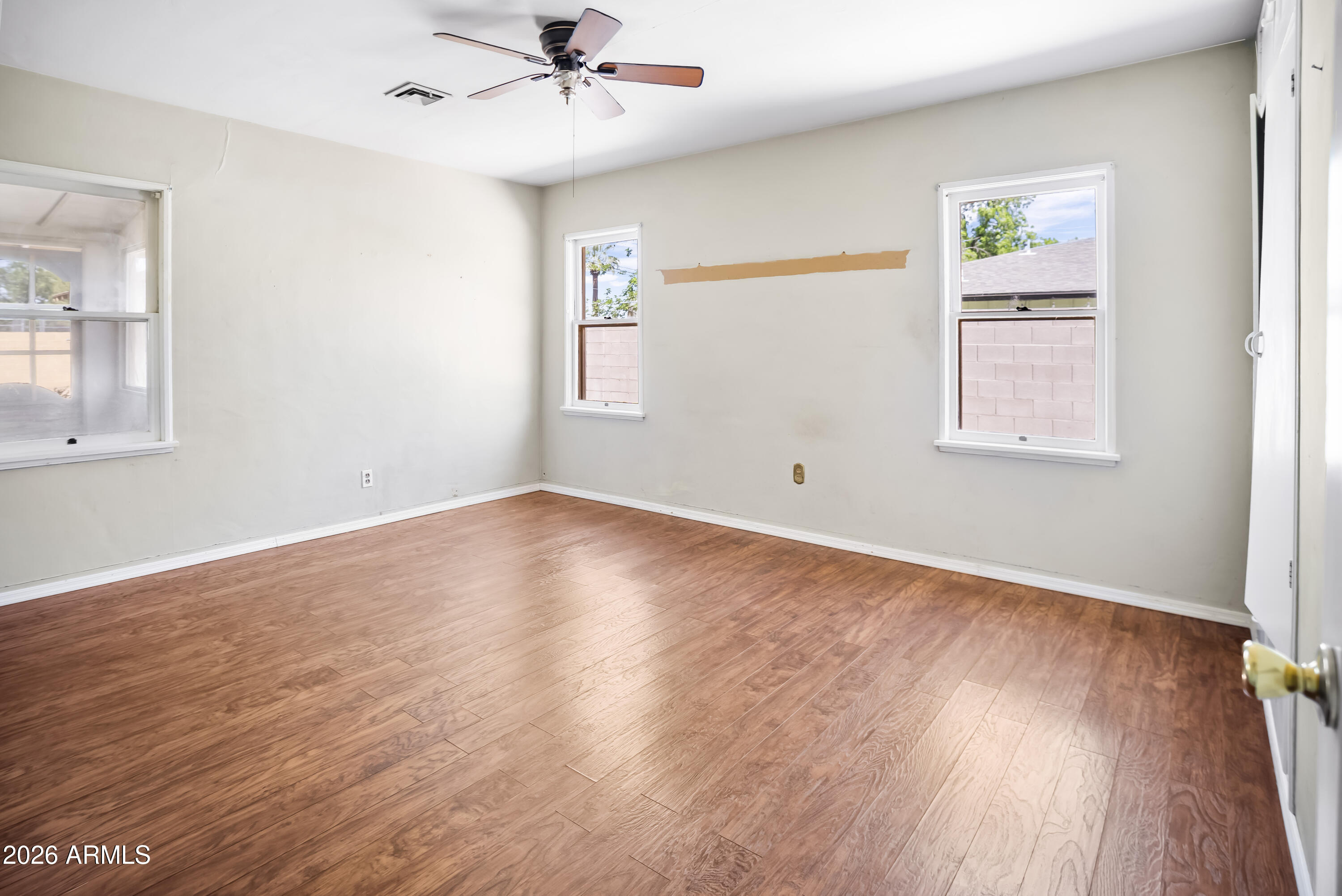 508 North Robson Mesa, AZ 85201 - Photo 7 of 19 a view of empty room with wooden floor and fan