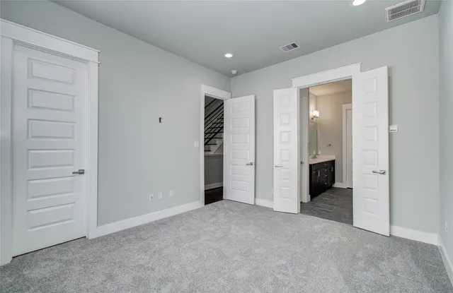 an empty room with closet area